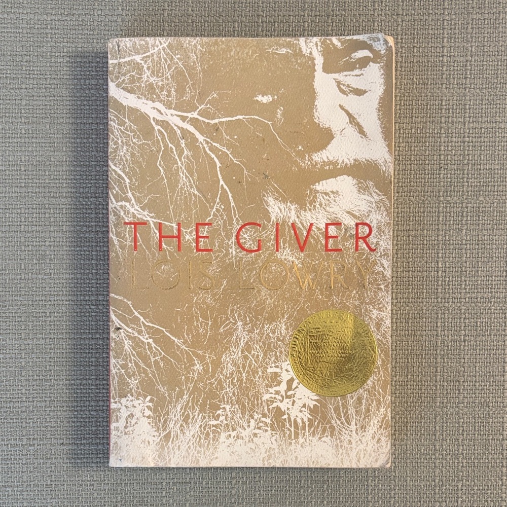 The Giver Book with Gold and Red Cover